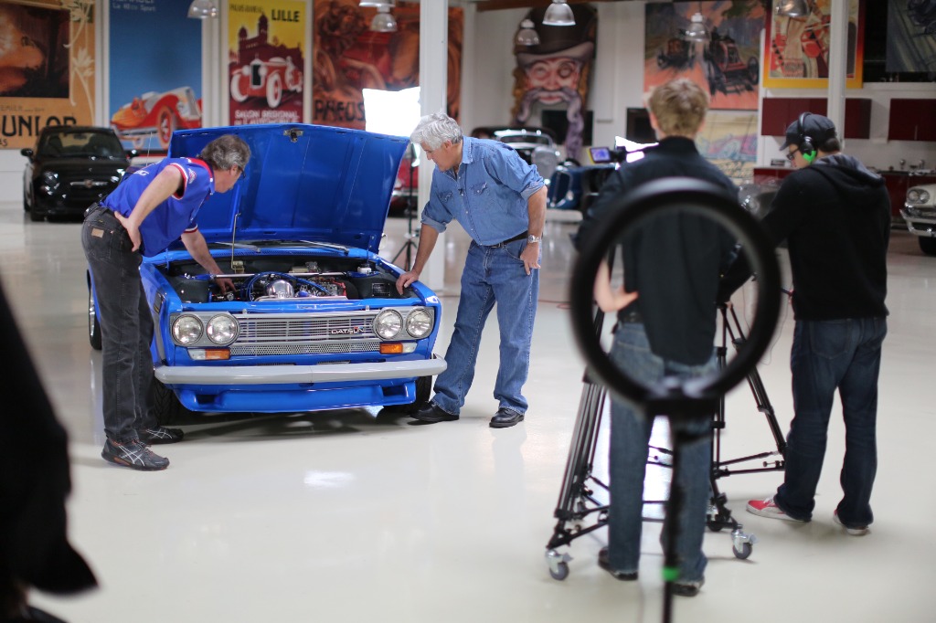 Filming a Datsun 510 engine bay in the garage.