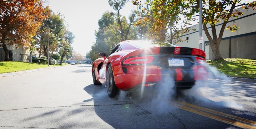 A Dodge Viper doing a burnout on location.